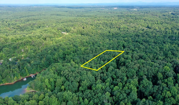 Majestic Waterfront 1.26 acre tract of land with beautiful hardwoods