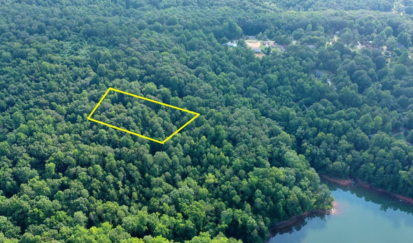 Majestic Waterfront 1.26 acre tract of land with beautiful hardwoods